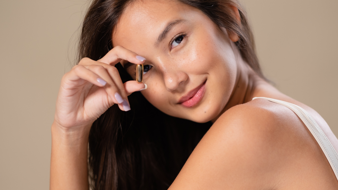 Woman holding a supplement capsule near her eye, symbolizing mental clarity and focus